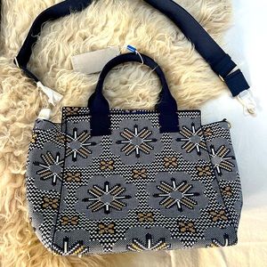 Rothy’s “the Handbag” Sunburst Navy. Brand new. Includes strap and dust bag.